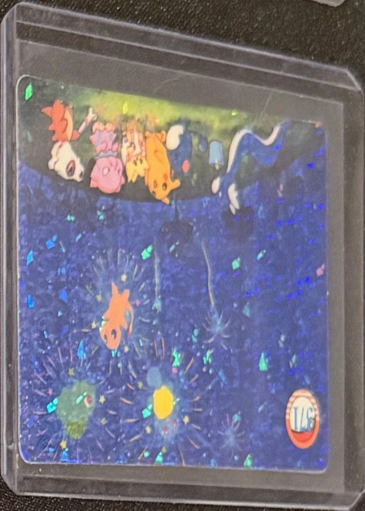 Pocket Monsters prism sticker — fireworks scene, graded RAW · UNGRADED — the exact slab for sale