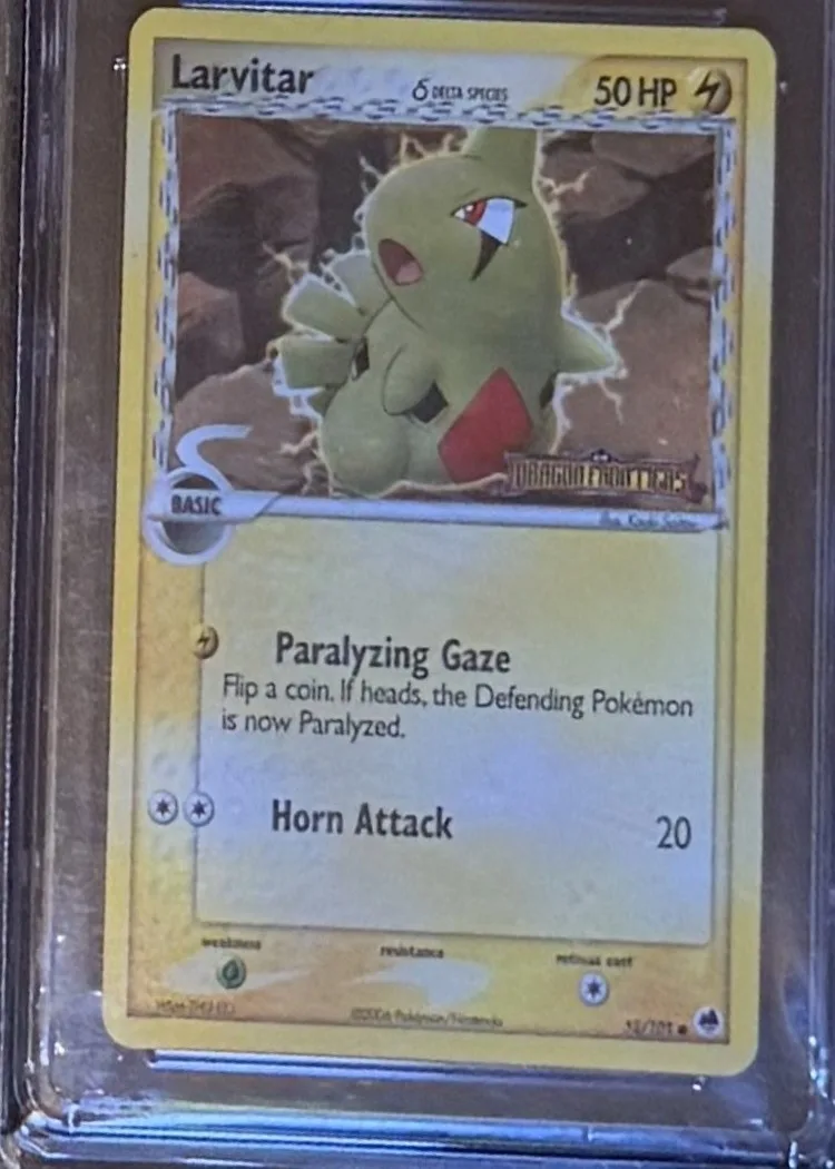 Larvitar (reverse holo), graded CGC 7 — the exact slab for sale